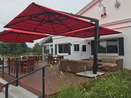 Red is such a great color for a large umbrella. Double Offset Patio Umbrella By The Shade Experts Usa Offset Patio Umbrella Patio Shade Patio Umbrellas