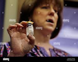 Registered Nurse Babette Richter, with the South Jersey AIDS Alliance,  holds up a container of the heroin overdose antidote, naloxone in Camden,  N.J.