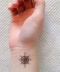 The compass has been an indispensable tool since its ancient conception, guiding the traveler to his destination in both the literal and metaphorical sense. Tiny Compass Tattoo On Wrist For Girls Tiny Tattoos For Girls Tattoos For Guys Small Tattoos