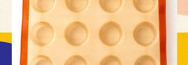 Place filled silicone cups either on a metal muffin tin or baking sheet for stability during baking. Silpat S Newest Muffin Mold Makes Cupcake Liners Obsolete Brit Co