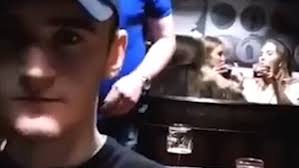 Lad flicks cheese puff over shoulder and into girl's glass 20ft away