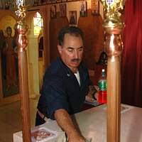 U.S. Navy Chaplain Lt. Michael Hendrickson helps clean up the Greek  Orthodox Church of New Orleans after Hurricane Katrina.