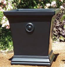 They create a columned entryway onto a flagstone path through the garden. Pots Urns And Planters Minneapolis Mn Twisted Elements