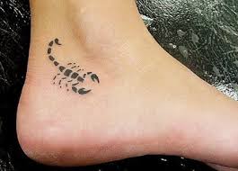 Colorful scorpion and flower on the back. Girly Small Scorpion Tattoo
