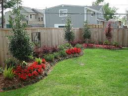 The fence and bench are made of redwood. Gainesville Backyard Landscaping The Masters Lawn Care