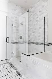 Greek Key Border Tile Bathroom Greek Key Border Tile The Glass Shower Features Marble Subway Wall And Floor Tiles Glass Shower Shower Doors Glass Shower Doors