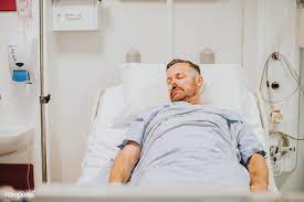 download premium image of sick man in a hospital bed 513579 hospital bed medical photos sick man