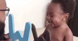 Adorable toddler in hysterics at dad trying to teach him the alphabet