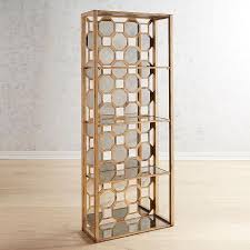 Four glass shelves are situated in an antique gold metal frame that adds just the right amount of luster and glam to your space. Geometrical Mirrored Back Gold Metal Shelf