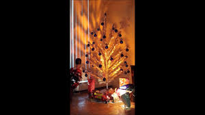 The trees fell out of style by the early 1970s, yet are fondly remembered and sometimes still shine in homes during the christmas season. Classic Aluminum Christmas Tree With Color Wheel Youtube