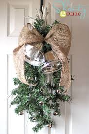 This 31 inch beauty is full of sparkly silver christmas ornaments, shiny ferns, huge, icy pine cones, a huge sparkly silver bow. Pottery Barn Inspired Silver Bells Swag Silver Bells Christmas Christmas Projects Diy Christmas Swags