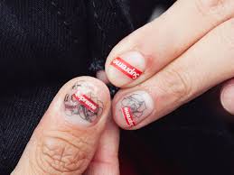G dragon and his tattoo from g dragons tattoos. This Tattoo Nail Trend Is What Guys Will Be Doing In 2018