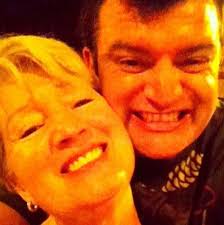 What are some curb appeal ideas for a remodeled house with black shutters  and brick exterior?