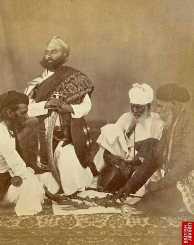 Circa early 1860's. India, Delhi. 'Rajpoots.' 'The group photograph shows a party of Chohan soldiers armed in the native manner. The figure on the right has a broad shield at his back,