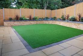 Artificial Grass Laid In Square Back Garden Make Your Home Design Dreams Come Tru Backyard Raised Garden Backyard Raised Garden Beds Artificial Grass Backyard