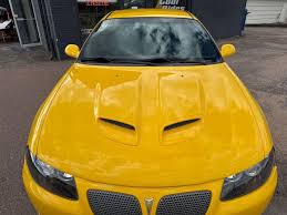 Image result for Yellow 2004 Pontiac