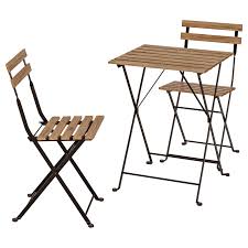 Tarno Table 2 Chairs Outdoor Black Acacia Gray Brown Stained Light Brown Stained Steel Ikea In 2020 Outdoor Dining Furniture Steel Table Wooden Outdoor Furniture