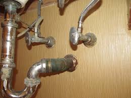 exposed pipes underneath bathroom sink