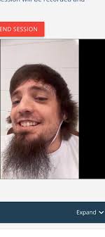 Department of Corrections... Corrections System... Do-Do? Video  Description: I am wearing a green, long-sleeve shirt and sitting in front  of a gray background. I have medium length brown, curly hair. Asking what