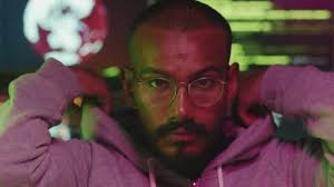 Horizontal close-up portrait shot footage of young male hacker wearing  eyeglasses putting