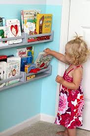 For the ultimate space saver, convert an entire wall to book storage, adding a lot of color and eye candy to a room. Wonderful Joy Ahead And What Got Painted Were Drumroll Kids Room Ikea Spice Rack Bookshelves Diy