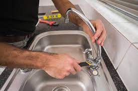 Your man repairing kitchen sink stock images are ready. Kitchen Sink Service Repair