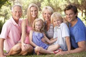 A Family With Parents Children And Grandparents Relaxing In Family Picture Poses Family Photoshoot Family Posing