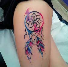 Colorful watercolor dreamcatcher tattoo on leg. Watercolor Simple Dreamcatcher Tattoo On Left Side Thigh By Paul Timman