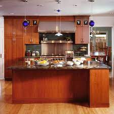This chocoate colored environmentally green cabinet is made from. Beautiful Cherry Cabinets Bamboo Floors Granite Counters Slate Back Splash Blue Accent Pendants Ho Eclectic Kitchen Design Eclectic Kitchen Kitchen Design