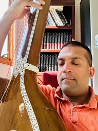 The award of Acharya Rathnakara is bestowed upon Vittal Ramamurthy, an  individual who has made a significant contribution to the classical arts  through teaching and training successful musicians. You can watch Acharya