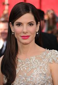 Sandra Bullock's ascent into global stardom began in Arlington, Virginia,  where she was raised after being born circa 1964 in Washington, D.C.,  immersed in a world shaped by her German opera-singer mother