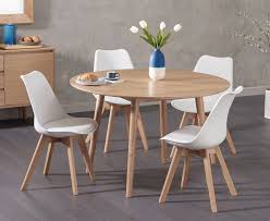 Oxford 90cm solid oak drop leaf extending dining table with demi fabric chairs. An Easy Way To Add Scandinavian Inspired Style To Your Home The Nordic 120cm Round Oak Dining Table With Duke Faux Leather Chairs Combines Good Looks With Practicality To Create A Set Thata S