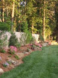 Natural Berm With Boulders And Plantings If Only I Owned My Own House Landscape Design Home Landscaping Outdoor Landscaping
