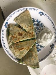 It can be either savory or sweet, featuring fillings such as spinach, lentils, pumpkin, or potato and scallion (what we're making today!). Homemade Afghan Bolani Panfried Flatbread Stuffed With Spinach Green Onions Peppers And Cilantro With Garlic Coriander Yogurt Sauce Food