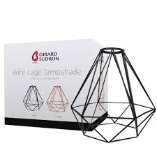 In a wall, an aperture whose sides have been cut back and/or whose underside has been sloped downward so as to admit a greater amount of light to the interior of the room. Abat Jour Cage Metal Noir H 21cm Girard Sudron Ampoules Service
