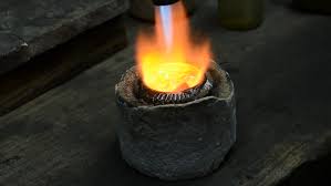 Once melted, gold can be poured into molds to harden or pounded with a mallet into thin strips. Goldsmith Melting Gold Stock Footage Video 100 Royalty Free 2733128 Shutterstock