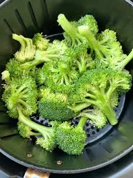 Add the frozen broccoli florets to the air fryer and air fry for 5 minutes (this will allow the broccoli to thaw a bit and the seasonings to stick). Easy Air Fryer Roasted Broccoli Cooking Video