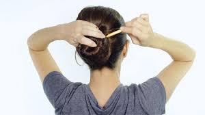 Backcombing helps to add body and visually enlarge the bun's size. 4 Ways To Put Your Hair Up With A Pencil Wikihow