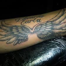 A nicely executed angel tattoo where the artist uses. Angel Wings Tattoo Men Arm Tattoo Design