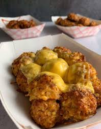 Then put the tots on, then added triple cheddar shredded cheese on top of the tots. The Easiest Cheesy Crispy Low Carb Cauliflower Tots Recipe
