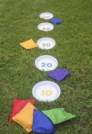 How To Make A Unique Bean Bag Toss Game From Terra Cotta Pot Saucers And A Printable Which You Can Get For Outdoor Party Games Diy Bean Bag Toss Bag Toss