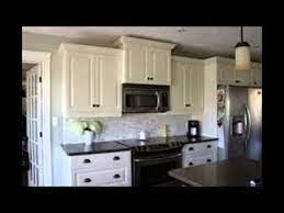 A simple design using white cabinets along with black countertop backsplash coveys a bold yet inexpensive and vibrant kitchen. White Kitchen Cabinets With Black Countertops Youtube