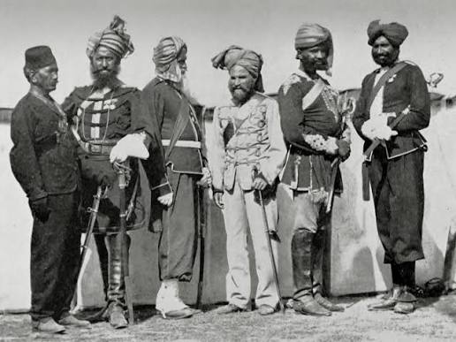 A #British-era poster titled "The Soldier of #India" offers a perfect representation of the soldiers of the British #Indian Army. A #Rajput soldier is depicted in the center. Around him are small