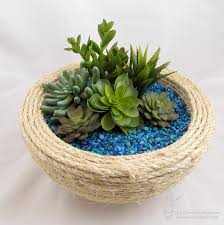 Dish gardens are created by arranging a variety of plants inside a single container, which is often a woven basket. Succulent Dish Garden Vicki O Dell