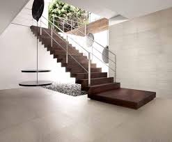 Black and white hues add a classic touch to the geometric cross design. Modern Ceramic Tiles Reinventing Traditional Interior Design Material Modern Floor Tiles Modern Tile Designs Modern Tiles