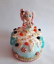 Different traditional candies such as sugar painting, candy doll, ding ding candy and dragons beard candy all convey symbolic meanings from wishing for increased fertility to stronger family ties. Candy Doll Cake By Mariya Gechekova Cakesdecor