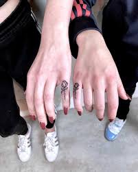 Matching Small Rose Tattoos On Pinkies For Best Friends Finger Tattoos Rose Tattoos Pinky Tattoo