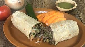 · these crispy fish tacos with jalapeño sauce are fried to golden brown perfection with a crispy cornmeal crust and served with a fresh, spicy homemade sauce! Guy Fieri Loves Roberto S Taco Shop S Carne Asada Burrito Robertos Taco Shop