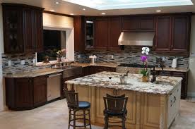 Bespoke cabinets in american walnut are finished with white bronze hardware and paired with deep green granite counter tops. American Walnut Rta Cabinets Cabinet City Kitchen And Bath