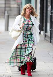 Kate wore a bright green dress adorned with large white and yellow daisies, and viewers couldn't decide if. Kate Garraway Cuts A Stylish Figure In A Bold Gingham Dress After Being Overwhelmed By Praise Daily Mail Online